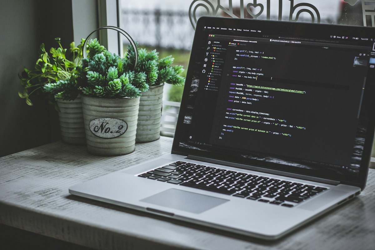 Dark monitor with JavaScript and React code — frontend framework comparison